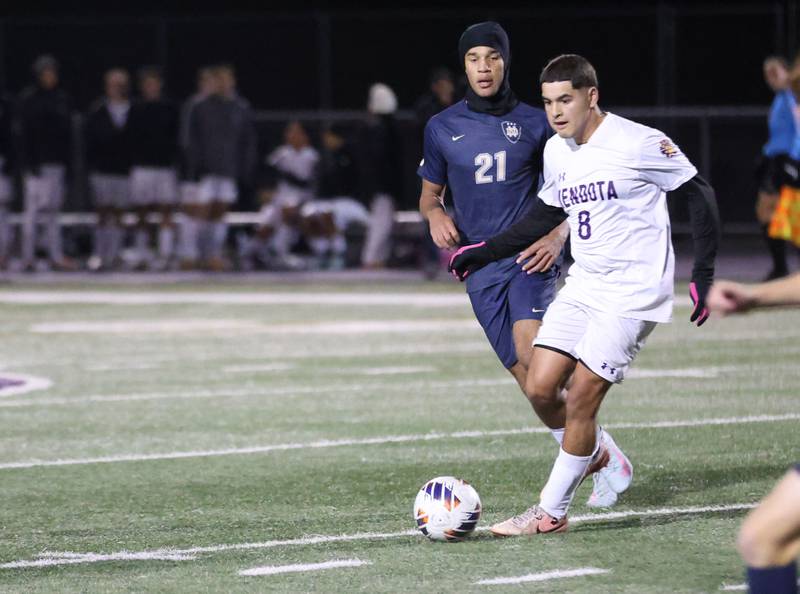 Mendota's Ramiro Palacios keeps the ball away from Quincy Notre Dame's Tj Togarepi defends during the Class 1A Supersectional game on Monday, Nov. 3, 2025 at Mendota High School.