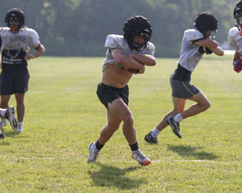 Jeff Ashley runs with the ball during Sandwich football practice Tuesday, July 22, 2025 in Sandwich.