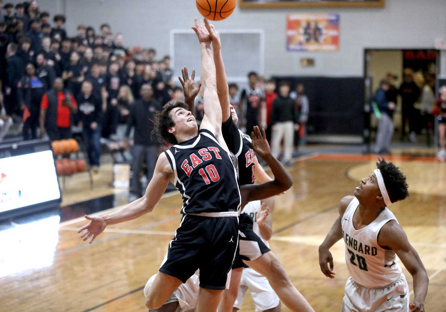 Glenbard East's Devin Kraft goes up for a rebound during a Class 4A St. Charles East Sectional semifinal against Glenbard West on Tuesday, March 4, 2025 in St. Charles.