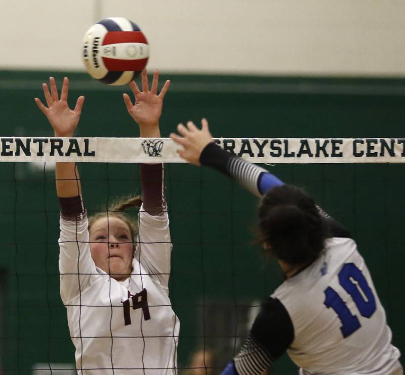 Prairie Ridge's Tegan Vrbancic tries to block the hit of St. Francis' Meg Taylor during the IHSA Class 3A Grayslake Central Supersectional volleyball match on Monday, Nov. 11, 2024, at Grayslake Central High School.