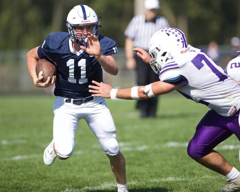Cary Grove's Peyton Seaburg runs for a gain against Hampshire on Saturday Oct. 5,2024 in Cary.