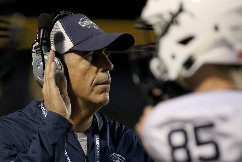 Cary-Grove coach Brad Seaburg talks with his players during their opening football game at Crystal Lake South High School on Friday, Aug. 30, 2019 in Crystal Lake.