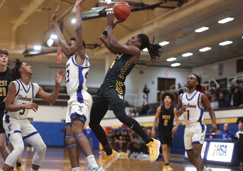 Joliet West’s Justus McNair takes a shot against Joliet Central on Saturday, Jan. 27th, 2024 in Joliet.