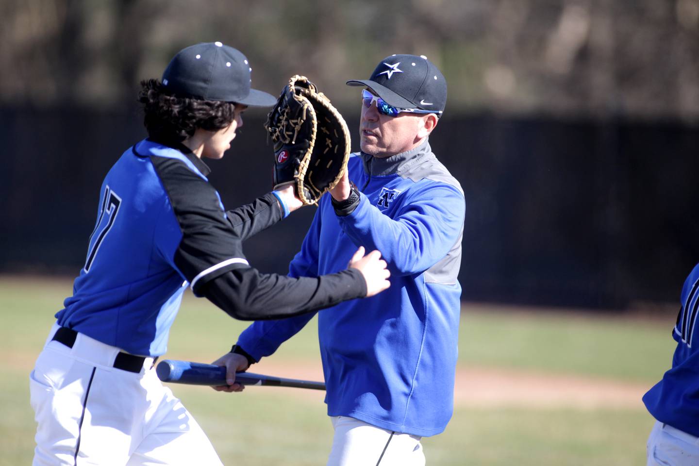St. Charles North Head Baseball Coach Todd Genke as third-base coach during a recent game against Kaneland High School. Genke, who has been coaching the North Stars since 2004, also teaches driver’s education, health and physical education at the school.