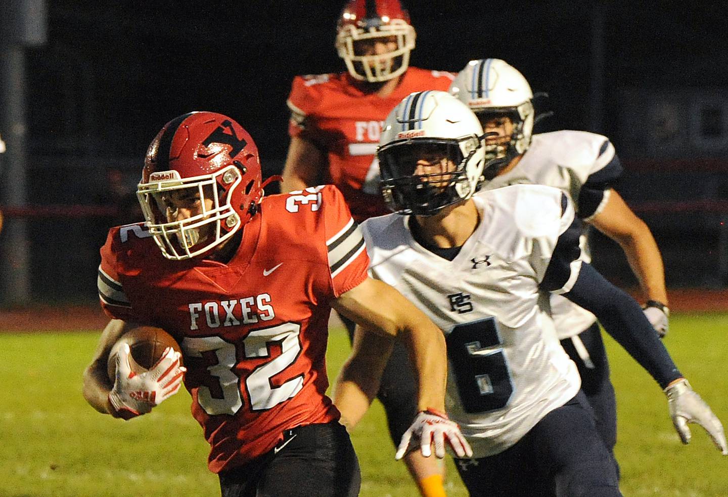 Yorkville running back Gio Zeman (32) gets past Plainfield South safety Liam Drapeau on way to a touchdown during a varsity football game at Yorkville High School on Friday.