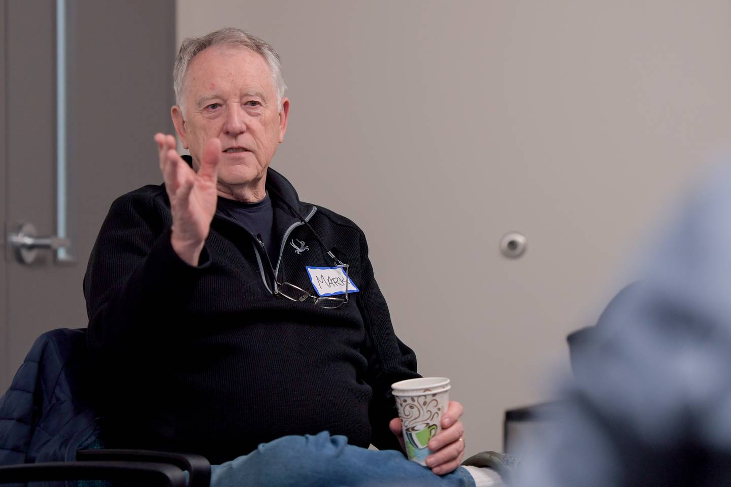 Mark Meginness of St. Charles voices his thoughts on the most current read "the phone book a the edge of the world" during the Hands of HopeÕs grief book club in Geneva on Monday, April 1, 2024.