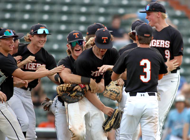 Crystal Lake Central players celebrate a win in supersectional baseball action against DePaul College Prep at Wintrust Field in Schaumburg Monday.