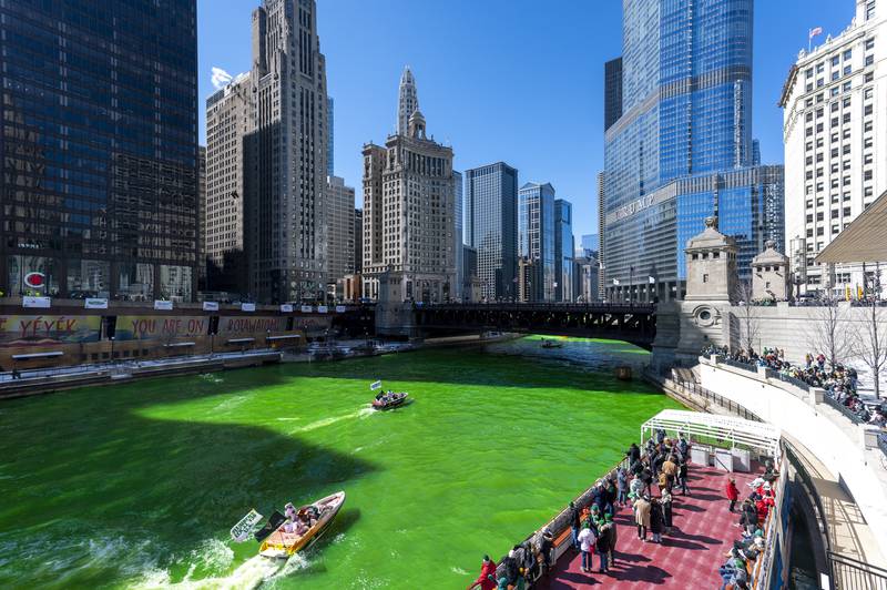The Chicago River appears green after the Plumbers Union Local 130 dyed it, Saturday, March 12, 2022, ahead of St. Patrick's Day.