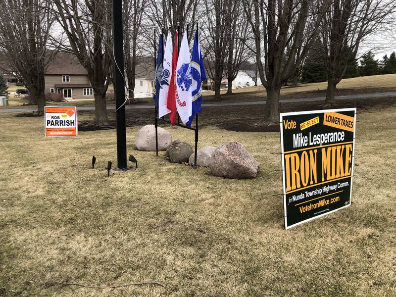 Signs for both Nunda Township Highway Commissioner campaigns in a McHenry yard on Tuesday, March 18, 2025.