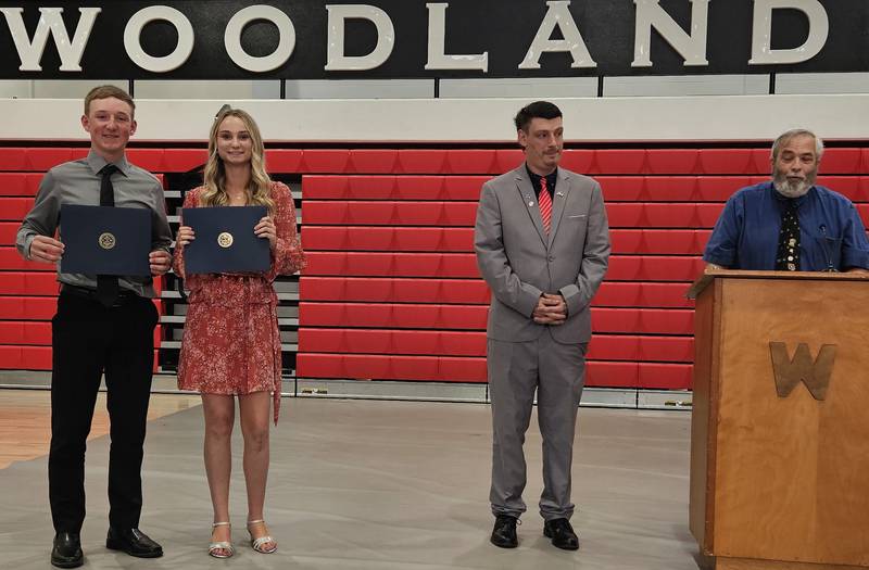 Victor Woodridge presents the Streator Masonic Lodge award to Dylan Jenkins and Cloee Johnston.