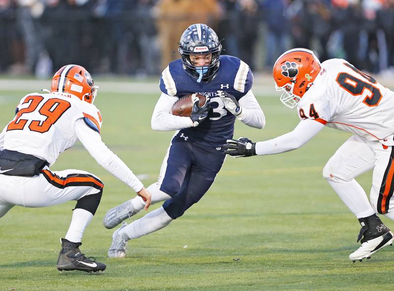 IC Catholic's Joey Gilatta (33) runs the ball during the Class 3A varsity football semi-final playoff game between Byron High School and IC Catholic Prep on Saturday, Nov. 19, 2022 in Elmhurst, IL.