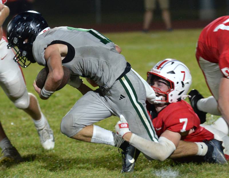 Oregon's Ethan Peeling (7) tackles a Rock Falls running back on Friday, Sept. 19, 2025 at Landers-Loomis Field in Oregon.