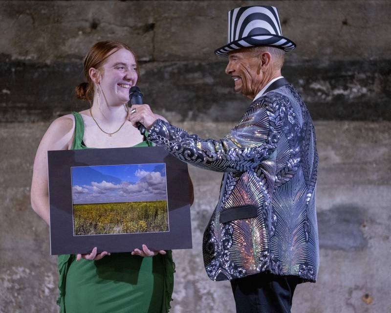 The Mad Hatter interviews Kaylee Lauck of Hall High School about one of her photos presented at the Mad Hatter Ball on January 17, 2024 at the Westclox Event Center.