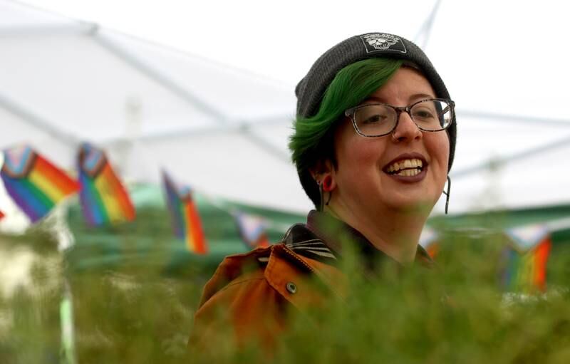 Shannon Mingalone greets visitors to the Ramshackle Farm booth during the farmers market Saturday, April 29, 2023, on the historic Woodstock Square.