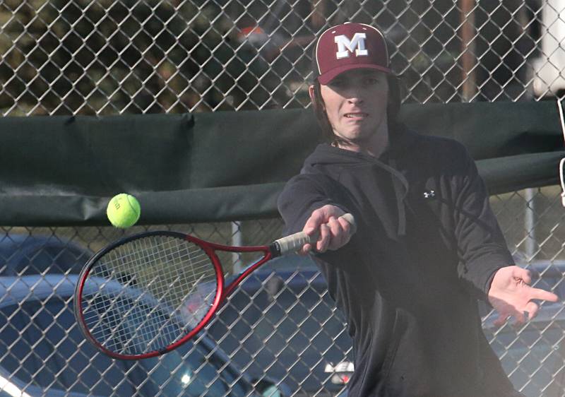 Morris's Mason Kitchell plays tennis against Ottawa on Tuesday, March 28, 2023 at Ottawa High School.