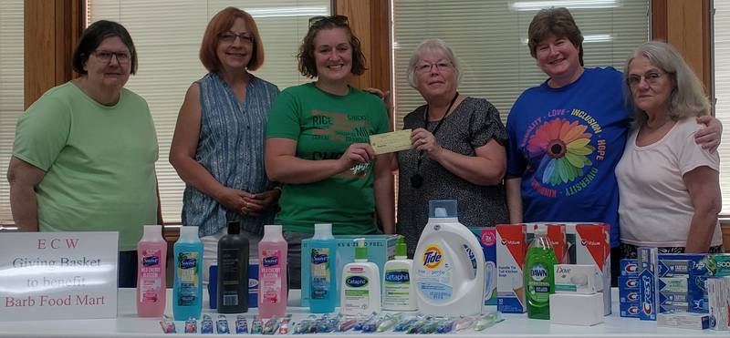 (Left to right); Women of St. Paul's Episcopal Church members Sandra Lee, Freyja Rasmussen-Johns, Barb Food Mart director Joey Moore, group members Peggy Newby, Lucinda Brunner, and Donna deOliveira