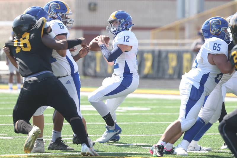 Joliet Central’s Paul Slick looks to pass against Joliet West on Saturday, Sept. 23, 2023 in Joliet.