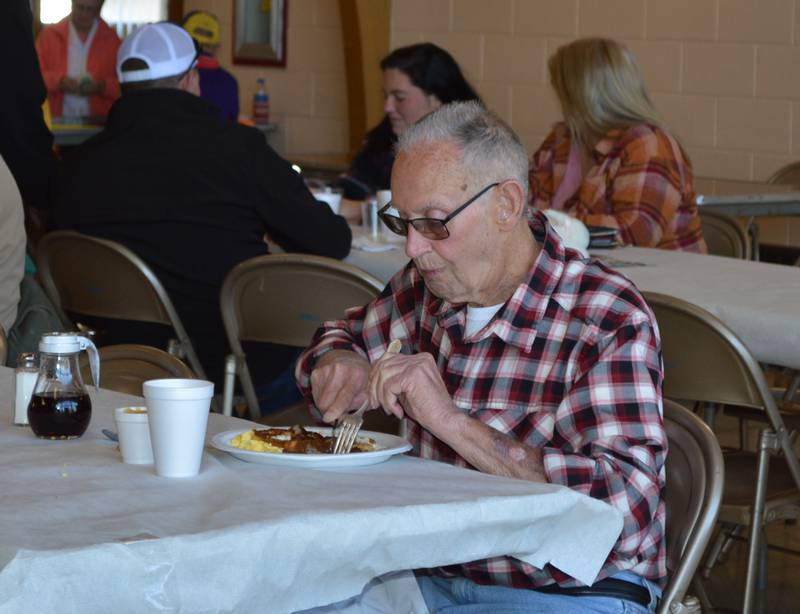Wayne Bicksler, of Freeport, slices his breakfast during Leaf River Lion's annual Breakfast with Bunny in the Bertolet Memorial Building on April 16.