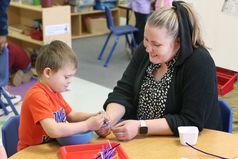 Laurel Copeland, Little Spartans Early Learning Program teacher at South Prairie Elementary School, works with student Henry Landis Wednesday, April 6, 2023, at the school in Sycamore.