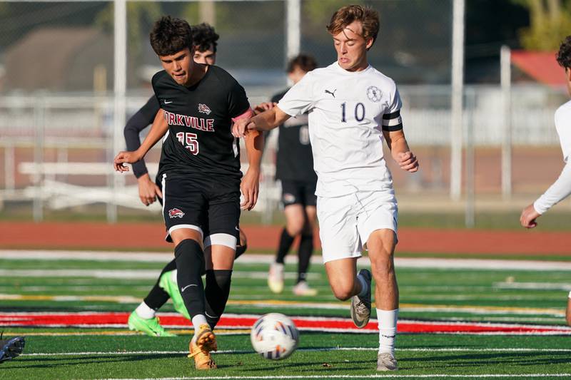 Yorkville's Mizael Terrazas (15) plays the ball against Oswego East's Dylan Drendel (10) during a soccer match at Yorkville High School on Tuesday, Oct. 15, 2024.