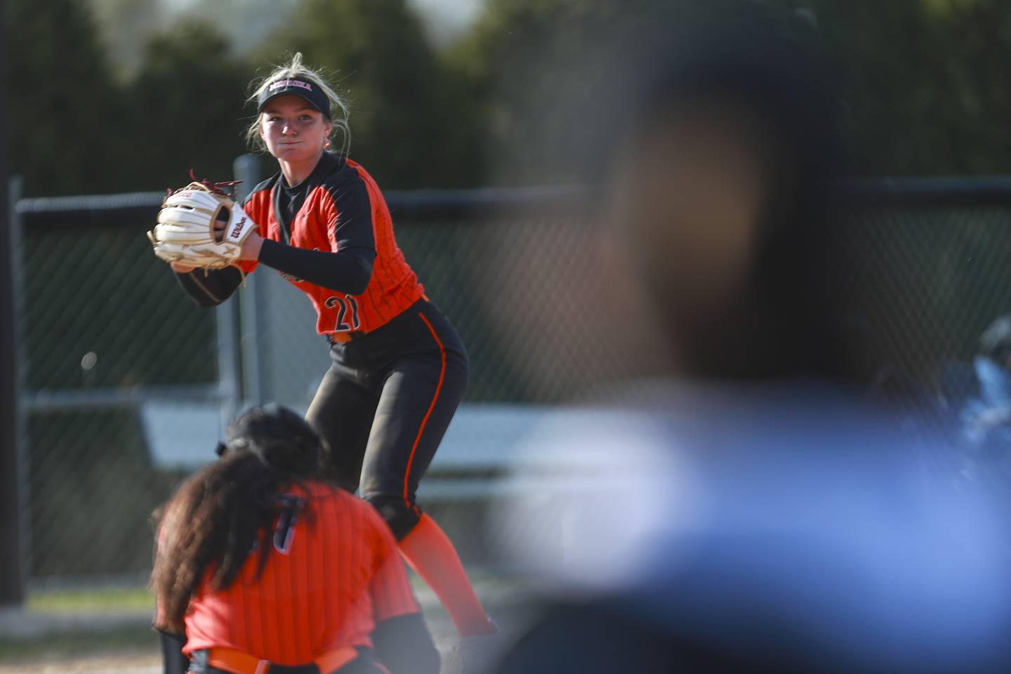 Minooka third baseman Megan Medlin prepares to throw out a runner on Thursday, April 22, 2021, at Lincoln-Way Central High School in New Lenox, Ill.