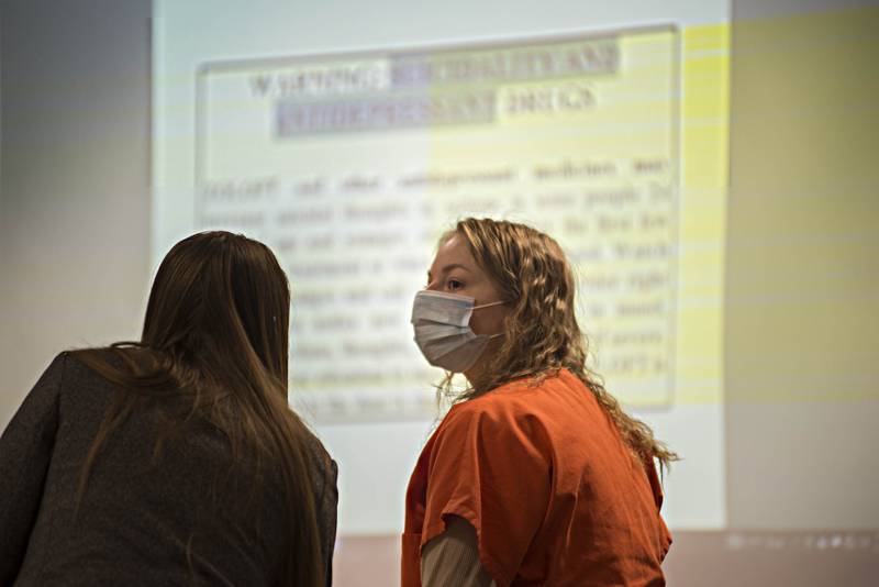 Anna Schroeder speaks with her attorney Christine Buskohl during her sentencing hearing Friday, Nov. 5, 2021 in Whiteside County Court. Anna, who killed her mother in 2017 received a 20 year sentence with day for day credit.