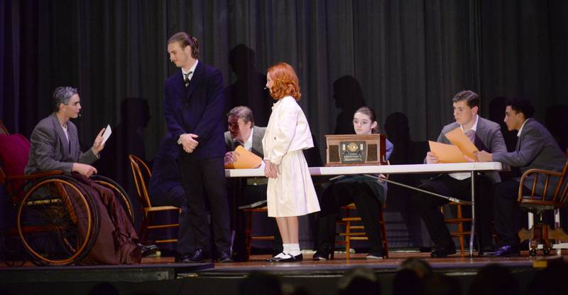 President Roosevelt (Micah Nelson) talks to Oliver Warbucks (Dane Setterstrom) and Annie (Lucy Schneiderman) during a scene with cabinet members during Forreston High School's performance of Annie on Sunday, April 28, 2024.