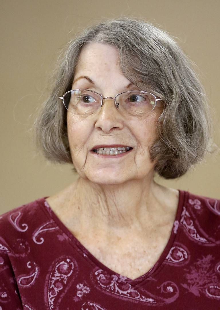 Audrey Burrows, of Wonder Lake, watches as her friends play bags Tuesday, Nov. 1, 2022, at the senior center in McHenry Township. About 70 million Social Security recipients will see a raise in their benefits to help keep up with inflation.