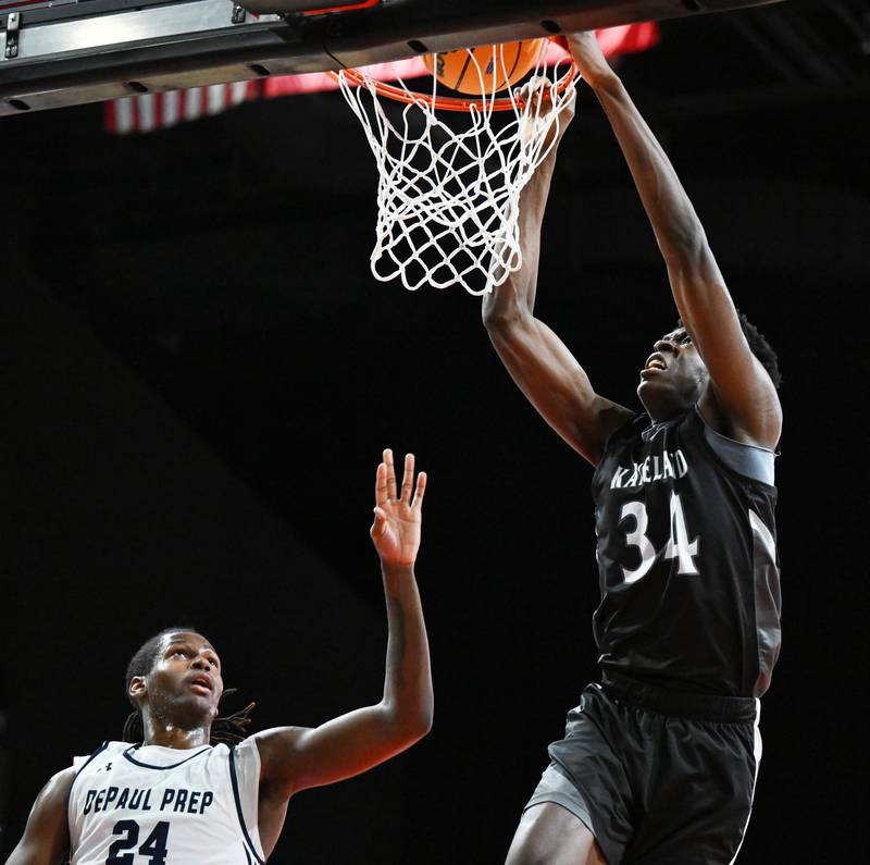 Kaneland's Jeffrey Hassan dunks over DePaul College Prep's Rashaun Porter during the Class 3A boys supersectional at NOW Arena on Monday, March 10, 2025 in Hoffman Estates.