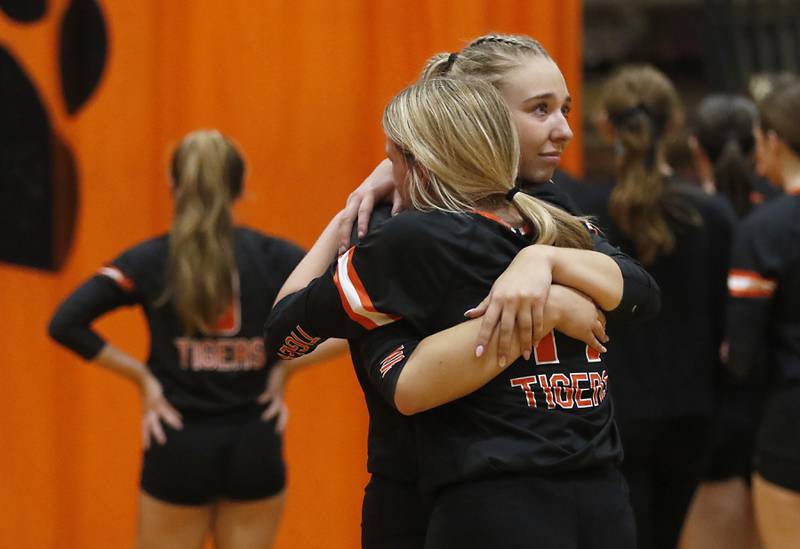 Crystal Lake Central's Emily Mazza (center) hugs her teammate, Crystal Lake Central's Alexis Hadeler after they lost the IHSA Class 3A Crystal Lake Central Regional volleyball final match to Crystal Lake South on Oct. 31, 2024, at Crystal Lake Central High School.