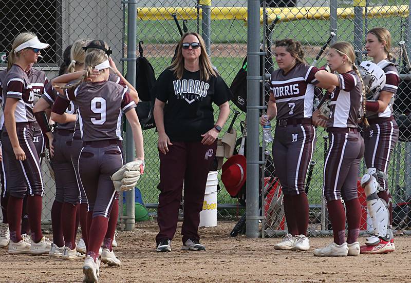 Morris softball coach Jean Bamonte huddles with her team while playing Ottawa on Monday, May 15, 2023 at Ottawa High School.