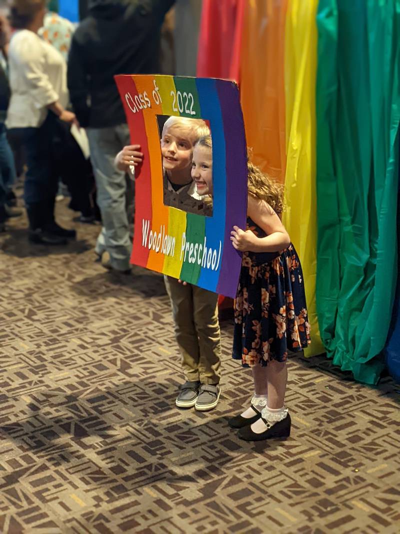 Woodlawn Preschool Academy graduates Elias Freed (left) and Annalise Wright pose for a photo after the graduation ceremony in April.