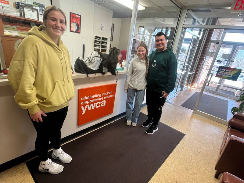 Sterling High School Key Club members (from left) Eleanor Aitken, Brenner Thompson and Gavin Fischer drop off hygiene items to the YWCA in Sterling.