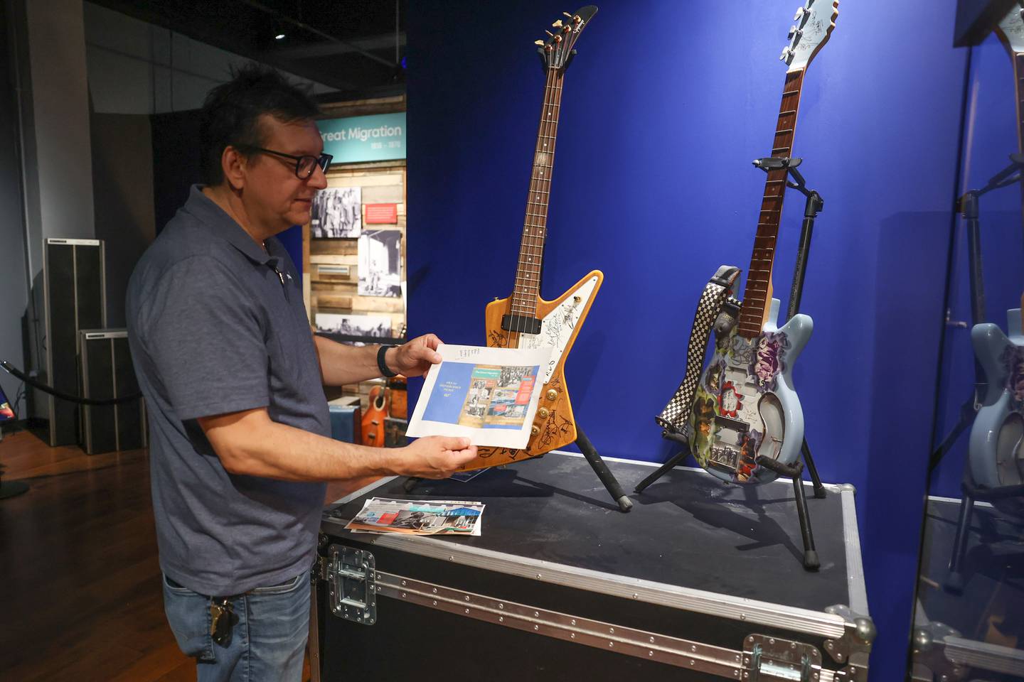 Ron Romero, Founder and Executive Director of The Illinois Rock and Roll Museum of Route 66, stands by his two guitars signed by notable artist, Paul Revere, Billy Sheehan, Eddie Money and Cheap Trick, to name a few. The Museum is expected to be fully open within the month.