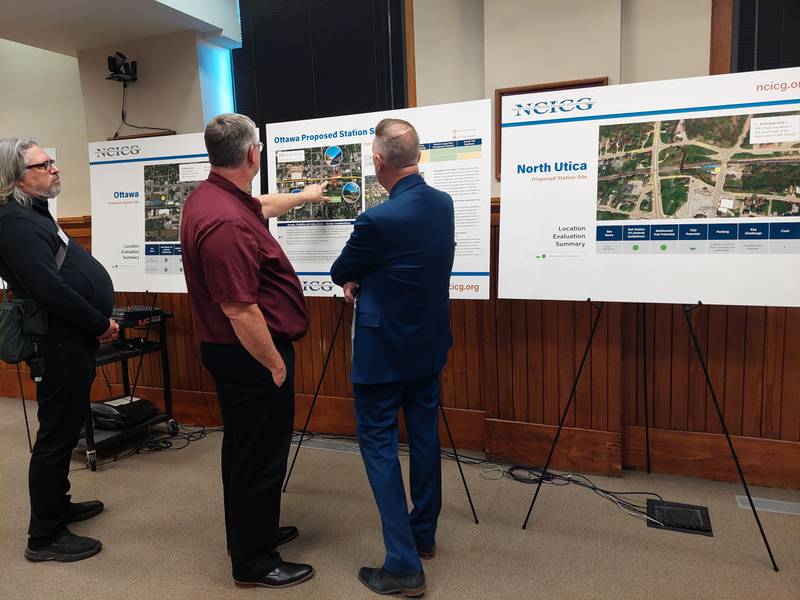 Dave Noble, economic development director of Ottawa, and Jay McCracken, executive director of the Ottawa Area Chamber of Commerce, look at the proposed train station locations for Ottawa on the Peoria to Chicago train line during an open house Wednesday, March 6, 2024, at Ottawa City Hall.