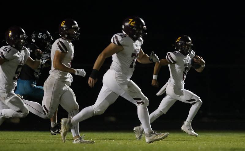 Richmond-Burton's Joseph Larsen (right) returns a punt during a Kishwaukee River Conference football game against Woodstock North on Friday, Oct. 10, 2025, at Woodstock North High School.