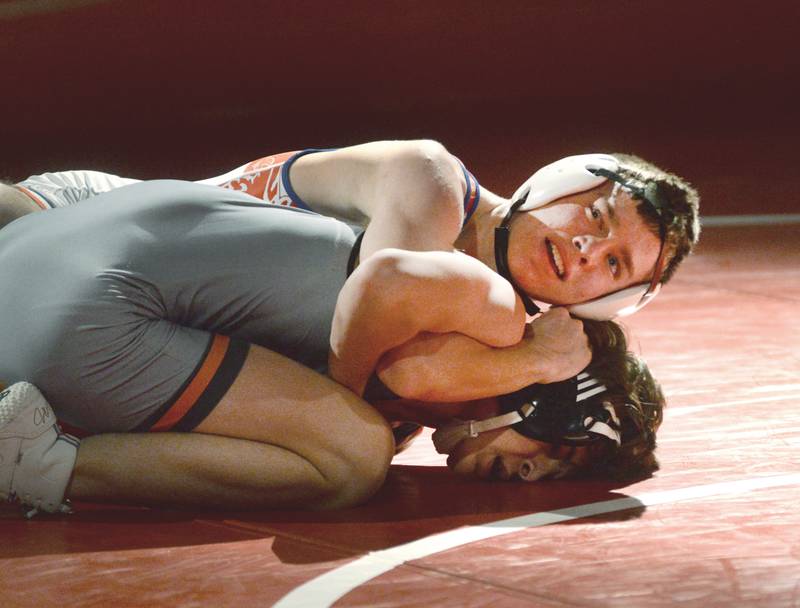 Oregon's Jackson Messenger (top) holds his Sandwich opponent to the mat during the 138-pound match at a triangular meet with Morrison on Friday, Jan. 31, 2025 in the Blackhawk Center at Oregon High School.