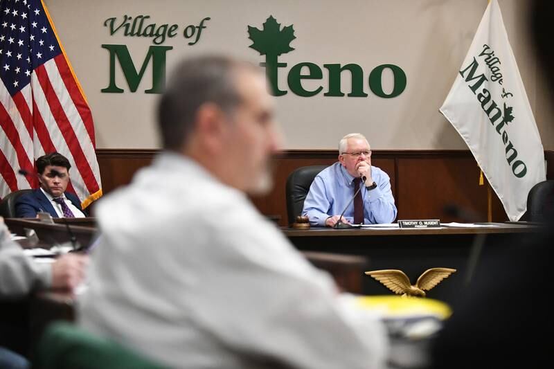 Manteno Mayor Tim Nugent and board members listens during public comment during the Manteno Village Board meeting on Dec. 18, 2023 at the Leo T. Hassett Community Center.