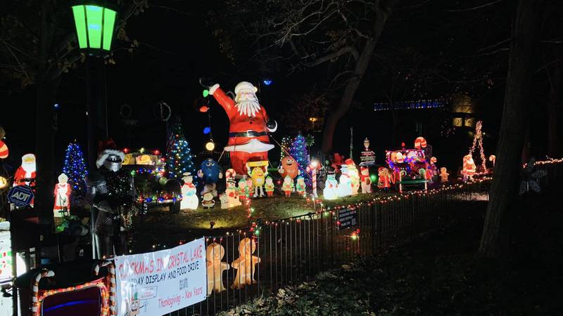 Jacci Richards-Click and her husband, Dan Click, collected food donations for the Family Health Partnership Clinic at the Clickmas Christmas display at 401 W. Woodstock Street, Crystal Lake, seen here in December 2022.