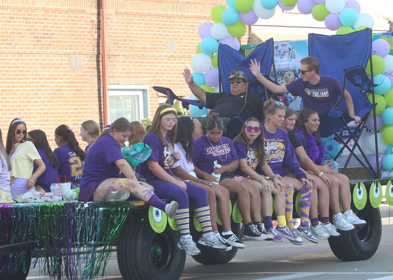 Members of the Mendota High School girls tennis team ride down Indiana Avenue during the homecoming parade on Friday, Oct. 3, 2025