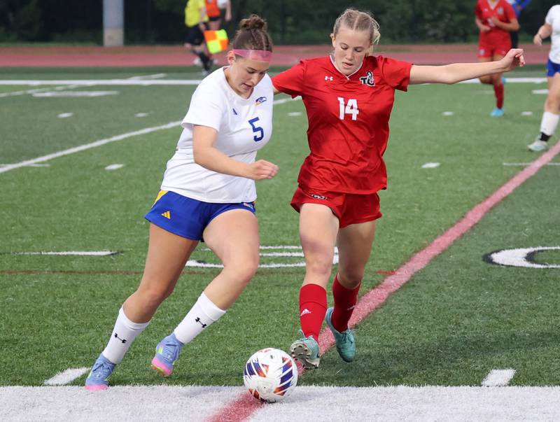 Johnsburg's Elaina Moss (left) and Timothy Christian's Kamryn Day go after the ball Thursday, June 5, 2025, during their IHSA Class 1A state semifinal at North Central College in Naperville.