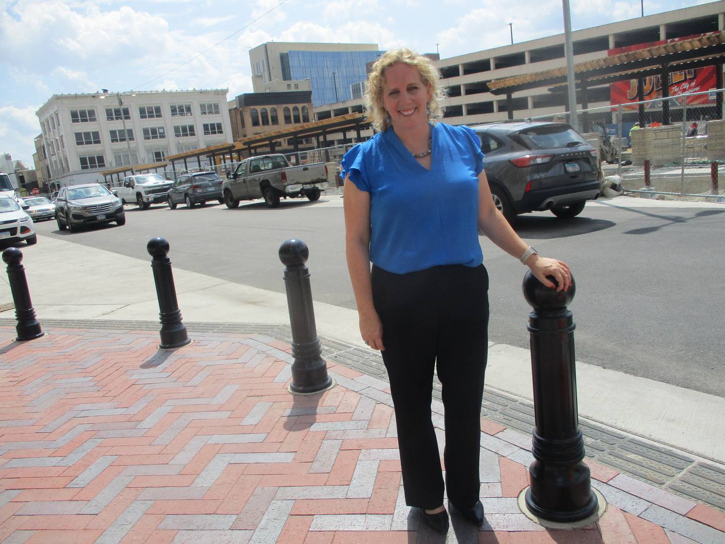 New Joliet Cultural Affairs Director Ann Sylvester stops for a photo on Chicago Street, which is being redesigned to attract more visitors into downtown Joliet. Aug. 15, 2025