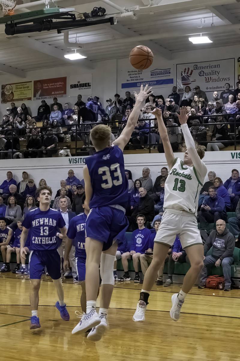 Rock Falls' Aydan Goff (13) shoots over Newman's George Jungerman during their nonconference game Wednesday, Feb. 15, 2023 at Tabor Gym.