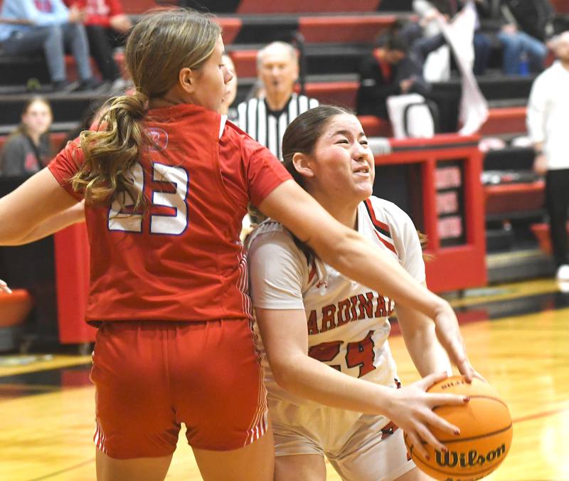 Forreston's Alice Kobler (24) makes a move to the basket as Oregon's Aniyah Sarver (23) tries to block the shot on Saturday, Jan. 3, 2026 at Forreston High School.