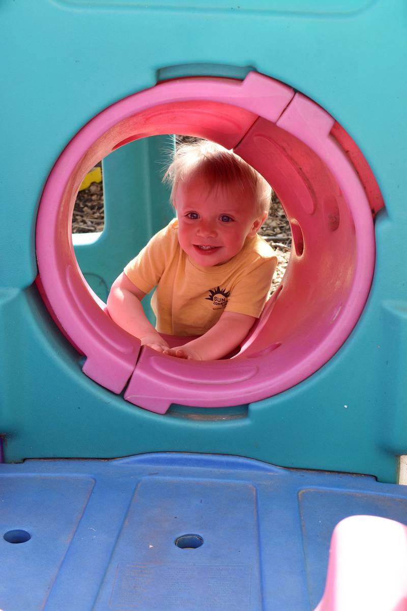 Wesley, 2, enjoys a session of climbing through the tube slide Saturday, May 10, 2025, at P&C Little Rascals’ open house.