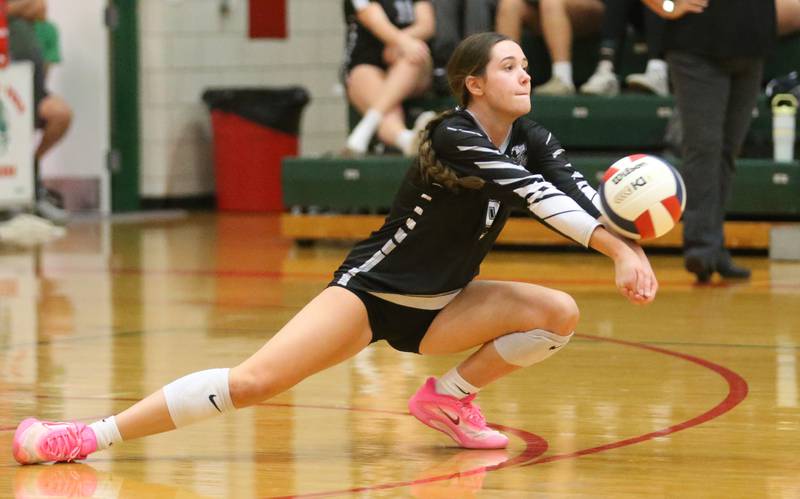 Kaneland libero Zoe Kraus digs a return from L-P on Tuesday, Oct. 7, 2025 in Sellett Gymnasium at L-P High School.