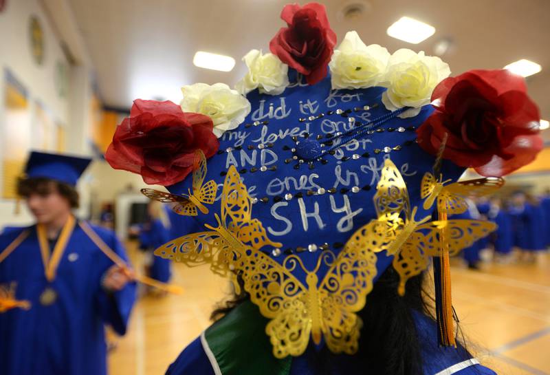 Lyons Township's  Cynthia Camarena of LaGrange Park honors her family past and present with her cap saying,  "I did it for my loved ones and the ones in the sky" graduation Wednesday May 25, 2022.