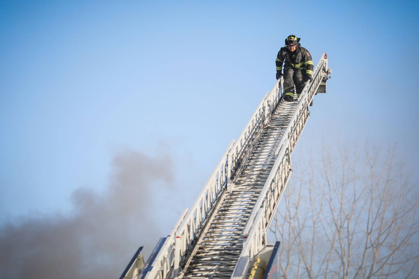 A firefighter at the scene of a fire at at Life Storage, 2301 W. Algonquin Road, Algonquin, on Sunday, Feb. 5, 2024. An estimated 25 to 35 storage units were damaged or destroyed, up from the initial estimate of 20.