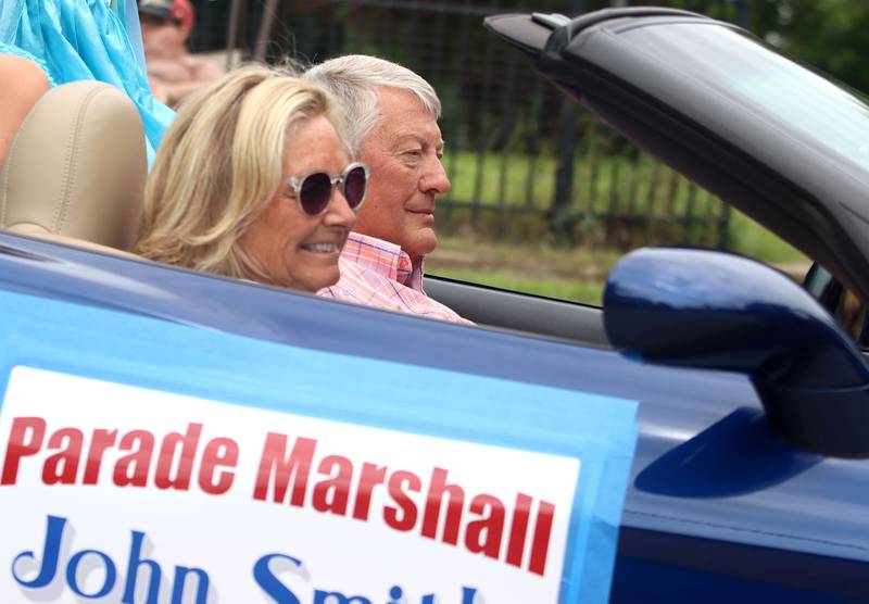 Parade Marshal John Smith pilots a Corvette as he participates in the Fiesta Days Parade on Main Street in McHenry on Sunday, July 20, 2025.
