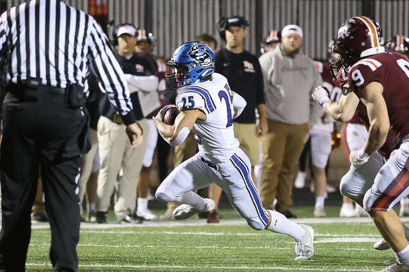 St. Charles North's Tommy Vendl rushes for a first down against Brother Rice in the third round of the playoffs on Saturday, Nov. 15, 2025 in Chicago.